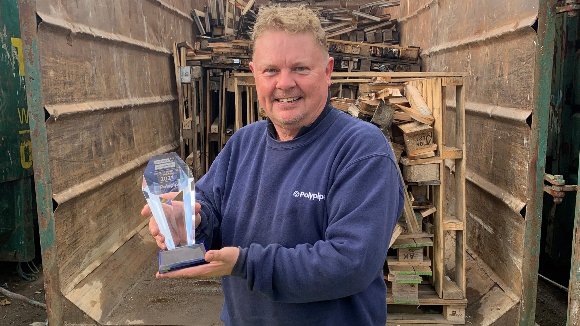 Polypipe Building Services recycling operative Paul Knight with the Recycling Award from Wolseley