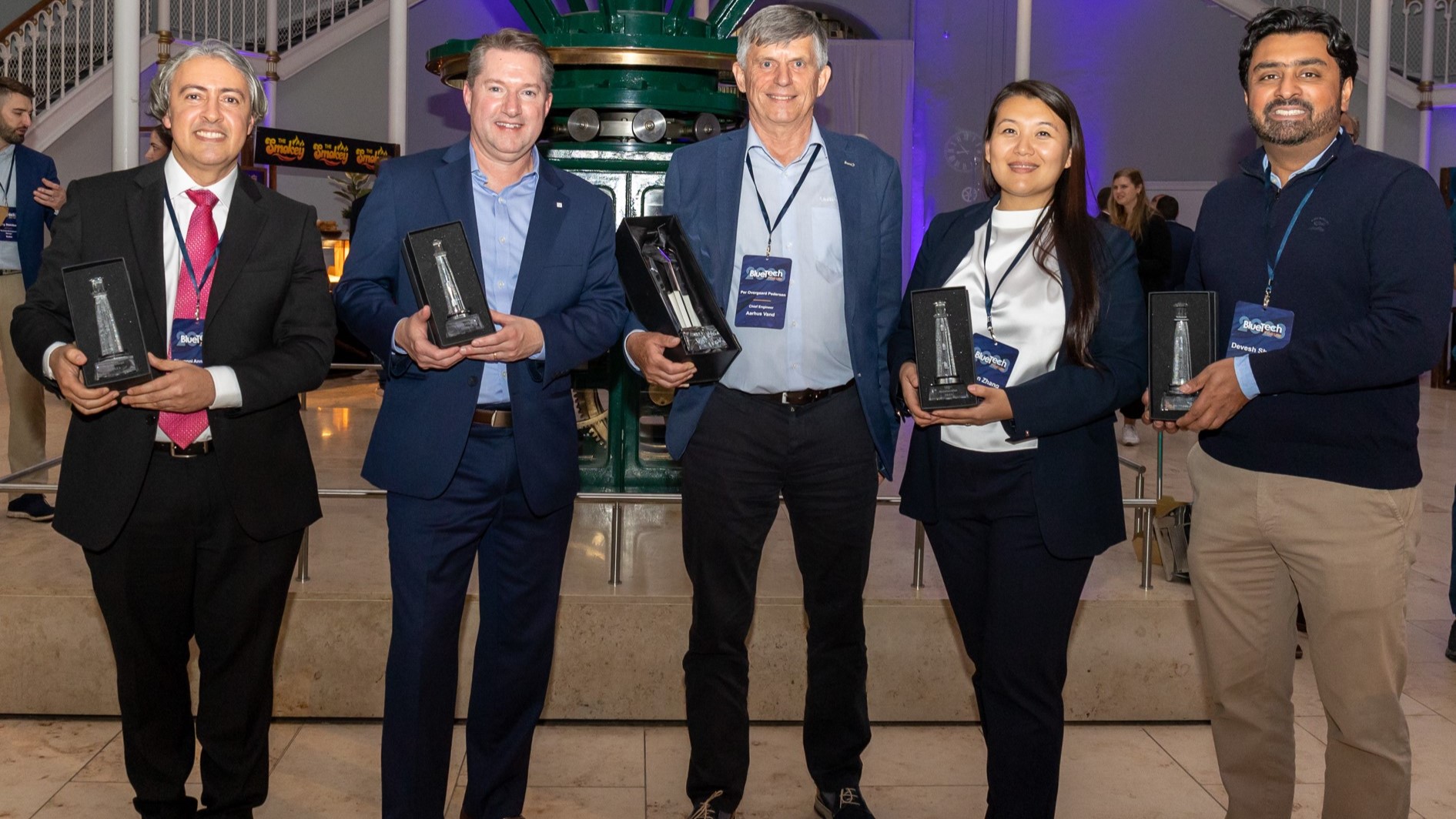 Group picture of 2023 Lighthouse Award winners. From left to right: Giovanni Annicchiar, Ecopetrol; Ralph Exton, Grundfos; Per Overgaard Pederson, Aarhus Vand ReWater; Molun Zhang, The Coca-Cola Company; and Devesh Sharma, Aquatech International.