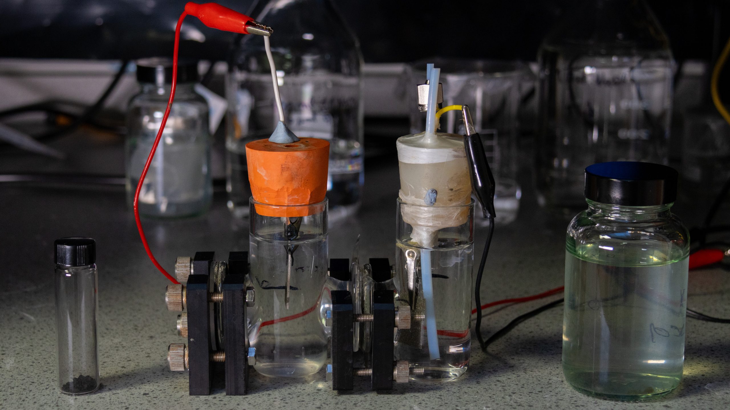 The lab experiment with nickel selenide nanoparticles (left), which act as a catalyst with whisky distillery wastewater (right).