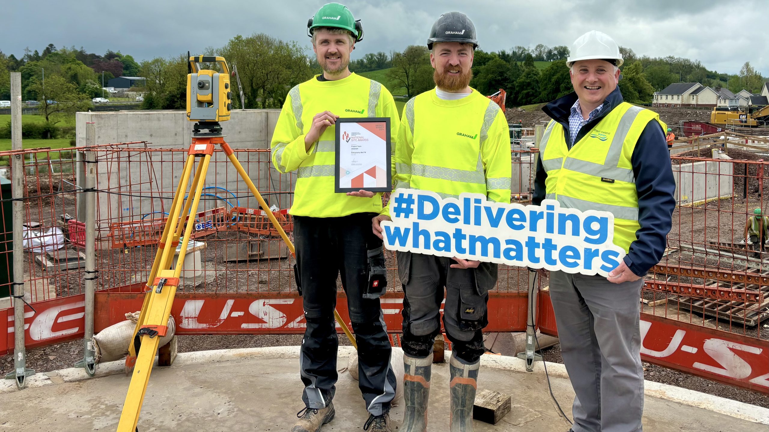 Pictured with their CCS Bronze Award on the site of the new £8m Ballygawley WwTW which is currently under construction are L-R: Graham Watson and Conrad Boylan of GRAHAM and Will Gibson, Senior Project Manager NI Water.