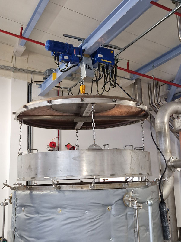 The 2-ton swl (safe working load) hoists raise and lower sealed vessel lids and baskets containing raw materials used in the production of gin. 