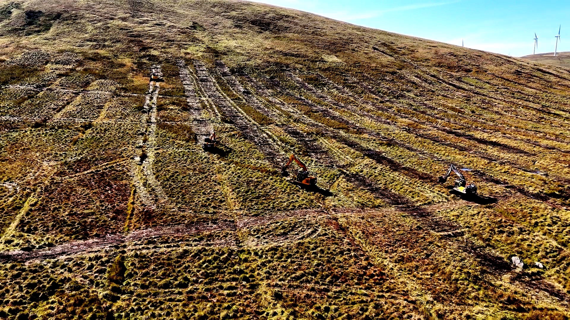 Aerial view of the land surrounding Afton Reservoir showing the closing of the drain using a technique called zippering 