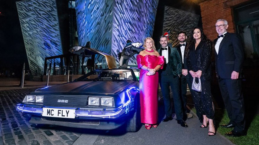 The DeLorean rolls into the Titanic for the WaterAid Ball! (L-R) Sara Venning WaterAid NI President and CEO of NI Water is pictured with Platinum sponsors of the event: Joe Cunningham Farrans, Sam McManus AECOM, event host Cool FM’S Rebecca McKinney and Declan Maguire from TES-CAW JV.