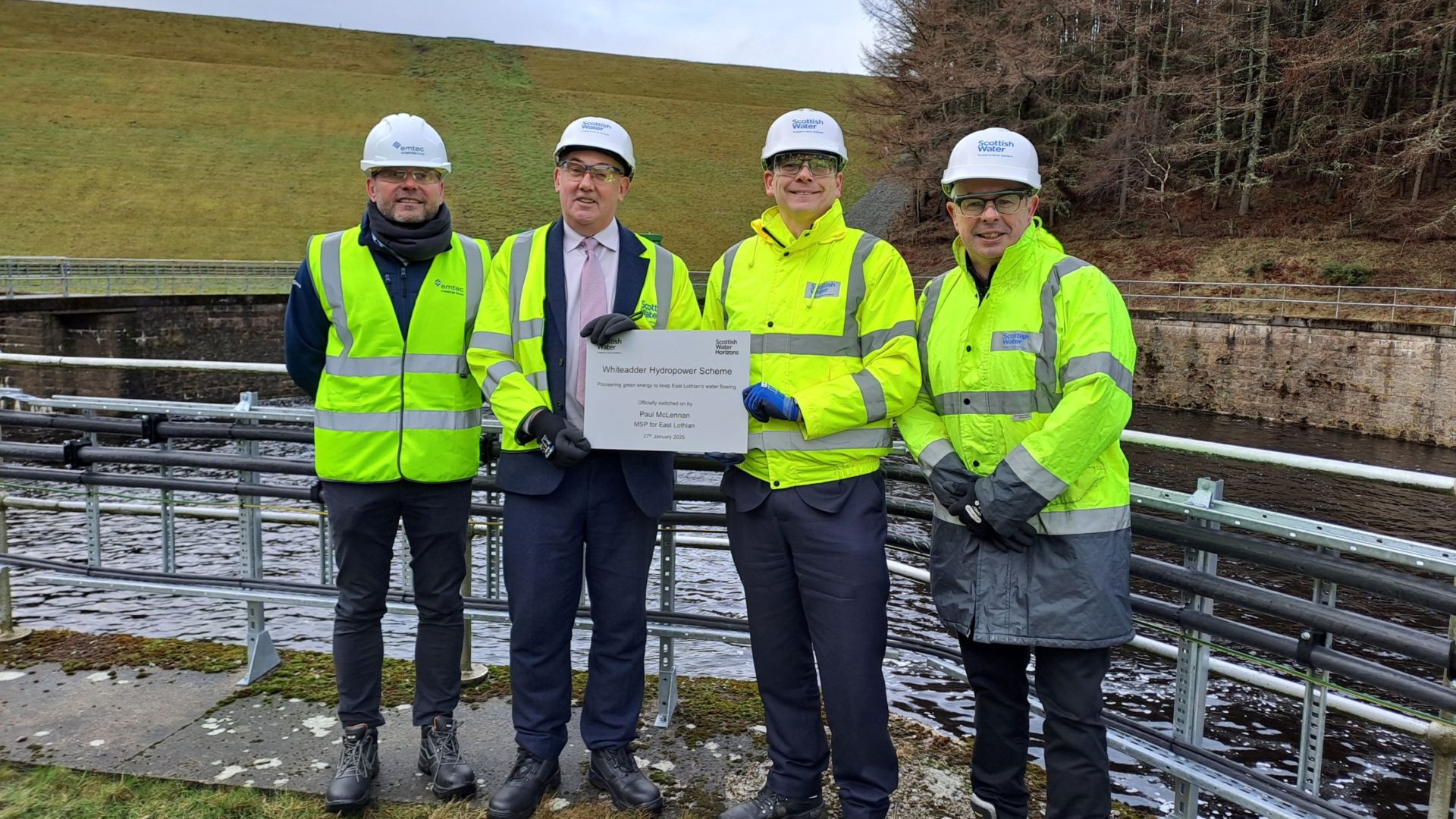 L-R Chris Clark, Director of Emtec Energy; East Lothian MSP Paul McLennan; Scottish Water Chief Executive Alex Plant; and Paul Kerr, Managing Director at Scottish Water Horizons, hold up the plaque which will be displayed in the turbine house to mark the official opening of the scheme