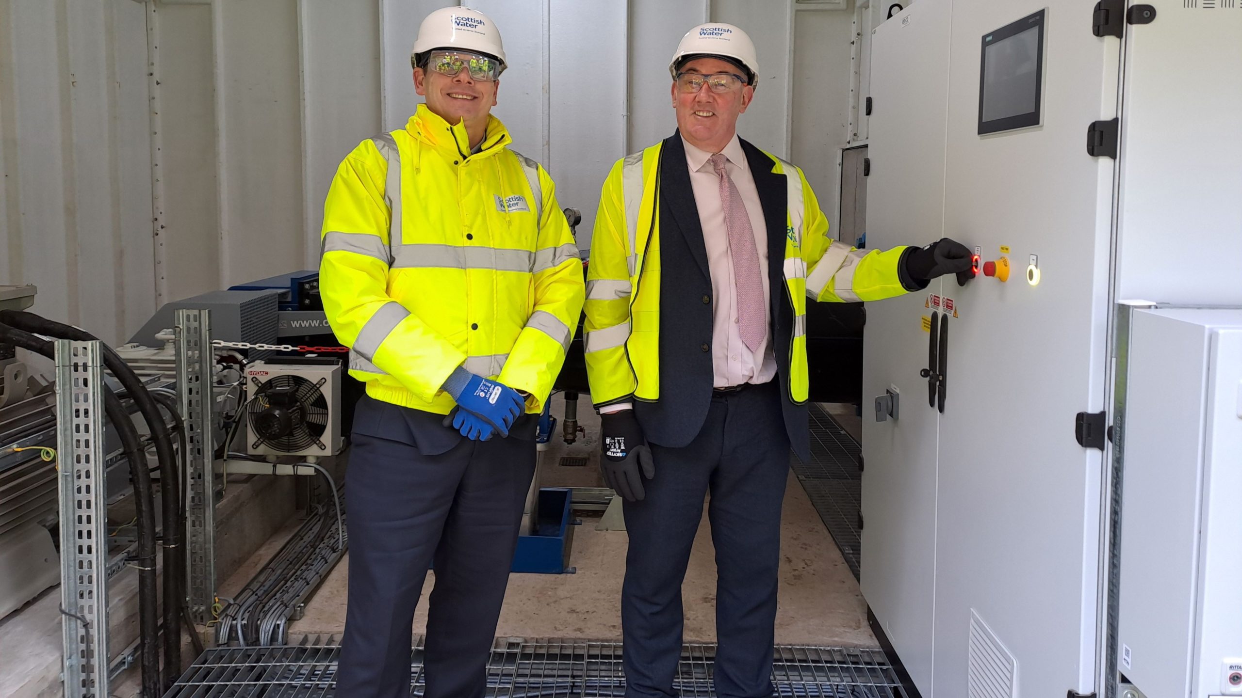 L-R Alex Plant and Paul McLennan MSP official push the button on the new hydro scheme 